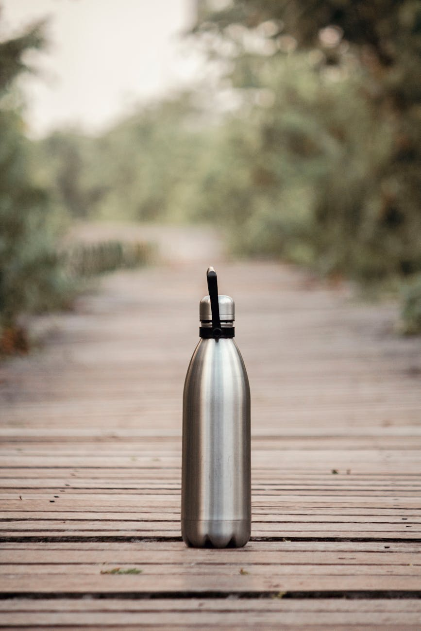 vacuum flask on brown wooden dock